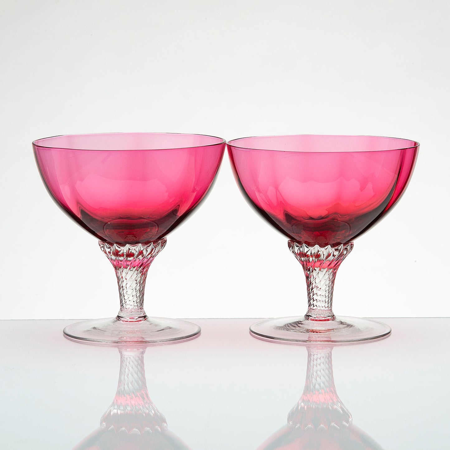 Vintage George Borgfeldt Lisa pink champagne glasses with clear twist stems, mid-century barware pair.