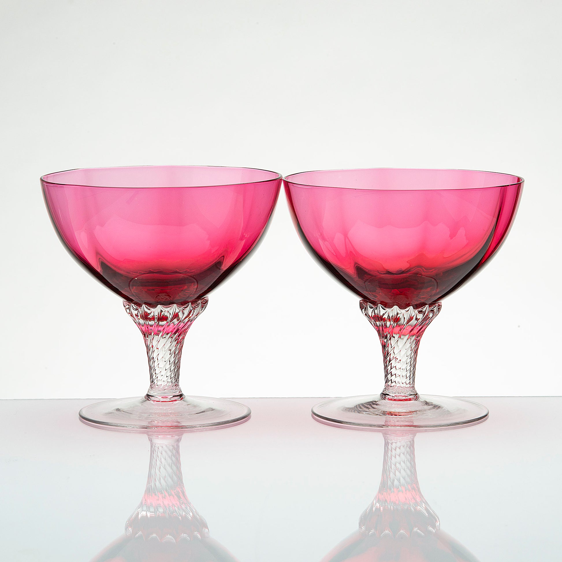 Vintage George Borgfeldt Lisa pink champagne glasses with clear twist stems, mid-century barware pair.
